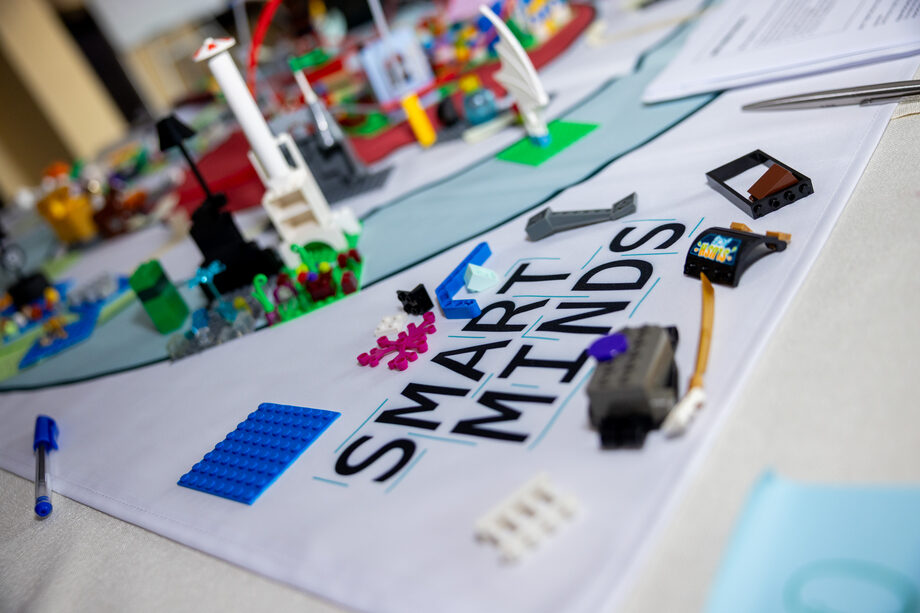 LEGO® models and materials on a Smart Minds workshop table.
